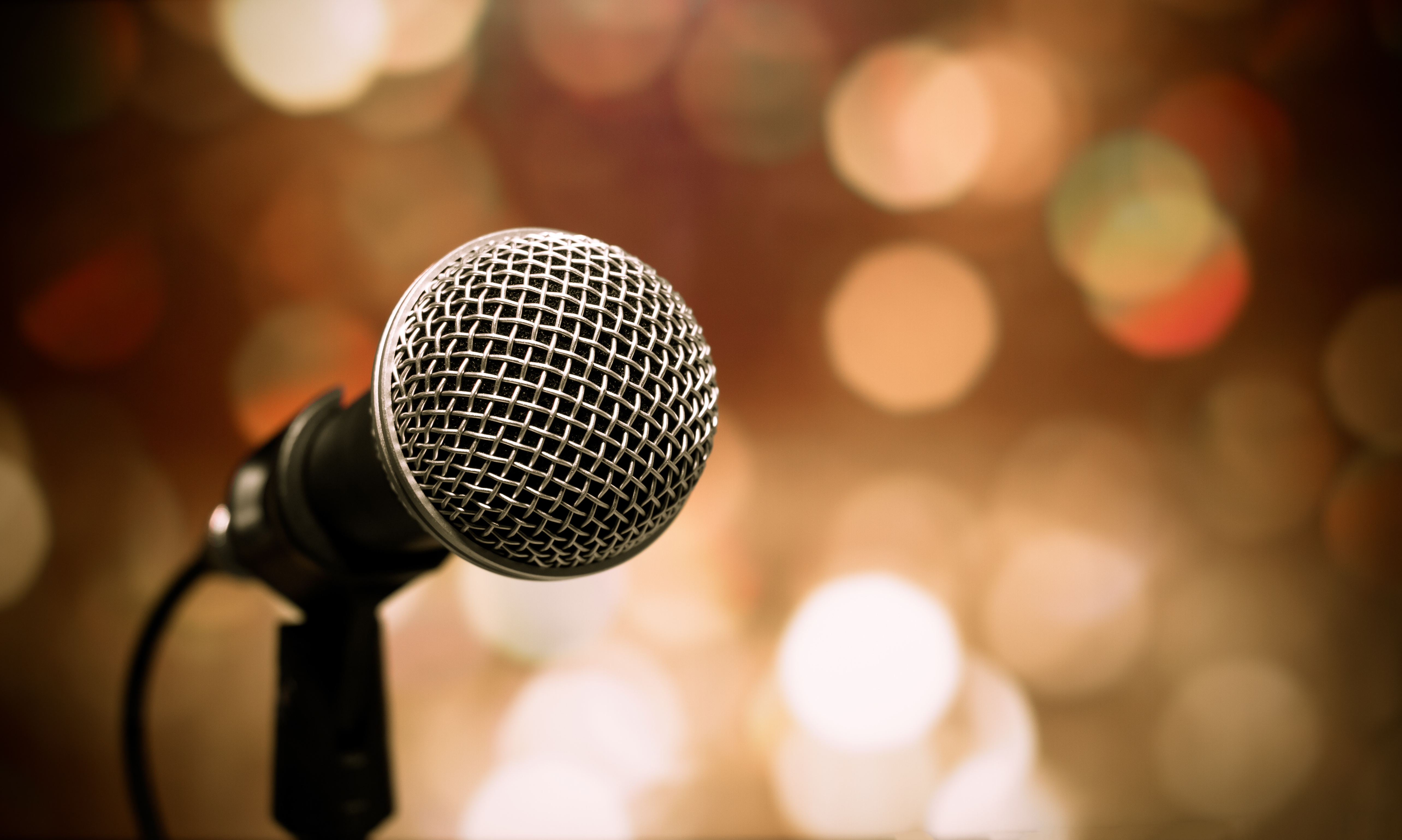 Blurred of microphones in seminar room, talking speech in confer